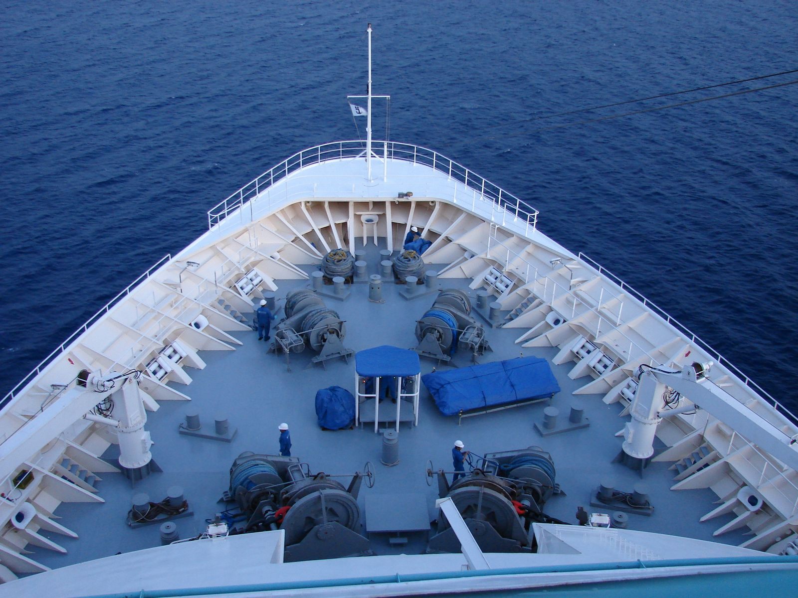 Looking down on the bow of a cruise ship over deep blue sea, the view a virtual cruise ship tour can show you before you book