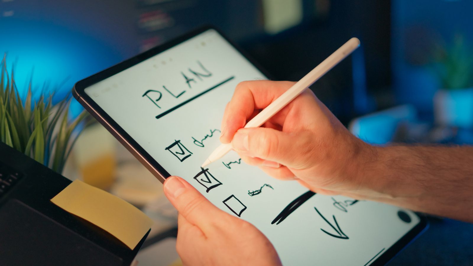 A person planning on a digital tablet with a stylus, comparing a cruise preview with reviews
